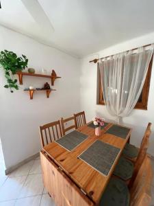 a dining room table and chairs in a room at Apartment Balatonfenyves in Balatonfenyves