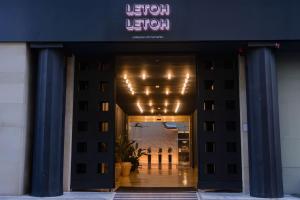 an entrance to a hotel with a sign on it at Letoh Letoh Sevilla in Seville