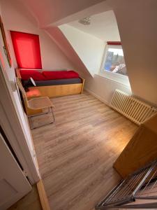 a small room with a bed and a window at Stranddüne in Cuxhaven