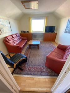a living room with couches and a table at Stranddüne in Cuxhaven