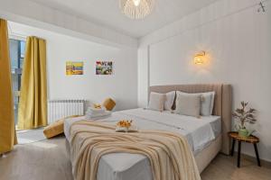 Postel nebo postele na pokoji v ubytování Olive Apartments in Meraki Resort & Spa