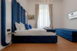 Postel nebo postele na pokoji v ubytování Historical Center