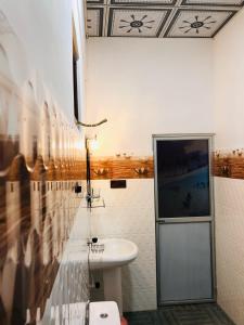 Koupelna v ubytování Calm Garden Cabanas + 37 fotografií