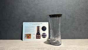 a glass vase sitting next to a box at Hotel Keihan Universal Tower in Osaka