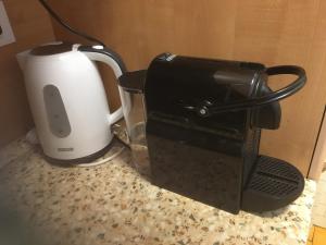 a coffee maker and a toaster sitting on a counter at Vista Bella House in Sanremo