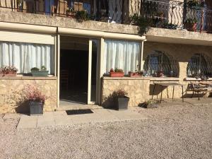 a building with potted plants on the side of it at Chez Laurette in Mirabel-aux-Baronnies