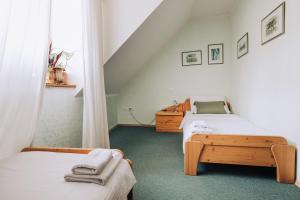 a bedroom with two beds and a window at Martinov Hram in Bovec