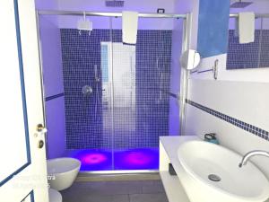 Een badkamer bij Relais Villa Olivi