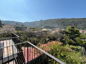 a balcony of a house with mountains in the background at Intero Appartamento a Sant'Agnello , Le Ortensie in Sant'Agnello