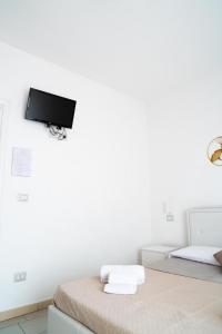TV a/nebo společenská místnost v ubytování Eulalia Bnb Alghero