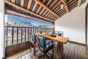 Balcó o terrassa a Jiuqi Tongnian High-end River View B&B