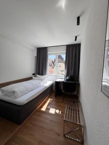 Postel nebo postele na pokoji v ubytování Boutique Hotel am Rathaus - Reblaus