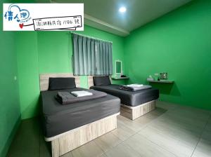Letto o letti in una camera di 情人灣二館