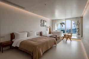 Almeta Designer Hotel客房内的一张或多张床位