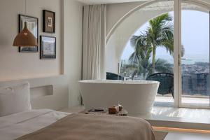 Almeta Designer Hotel客房内的一张或多张床位