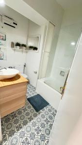 a bathroom with a shower and a sink and a toilet at Apartamento Mateuet in Calpe +23 photos