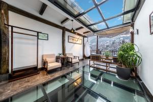 Zona d'estar a Jiuqi Tongnian High-end River View B&B