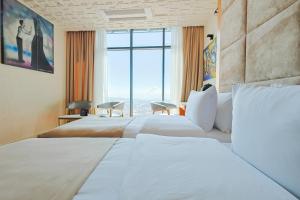 Voodi või voodid majutusasutuse Carat Hotel Yerevan toas