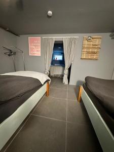 Postel nebo postele na pokoji v ubytování Apartment nähe Offenburg EuropaPark
