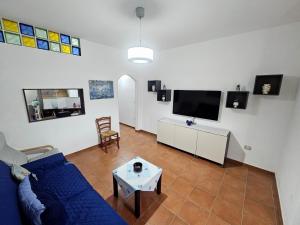 TV a/nebo společenská místnost v ubytování Domus Poseidone