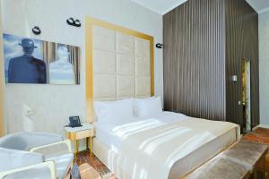 Voodi või voodid majutusasutuse Carat Hotel Yerevan toas