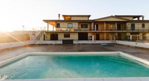 a large swimming pool on the roof of a building at Villa Olivieri B&B Wellness House in Viterbo +38 photos