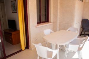 Telewizja i/lub zestaw kina domowego w obiekcie Apartamentos Topacio Unitursa