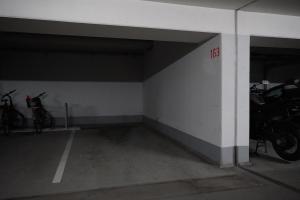 a parking garage with motorcycles parked in it at Apartment im Atelierhof in Nürnberg