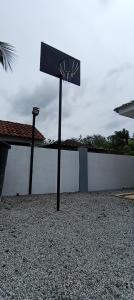 a basketball hoop in front of a building at Kvaloya Homestay Private Swimming Pool in Kampung Gurun