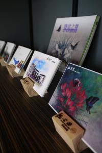 a row of cards sitting on top of a table at Grand Allevia Villa in Wujie