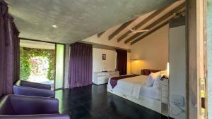 Temple Tree Retreat客房内的一张或多张床位