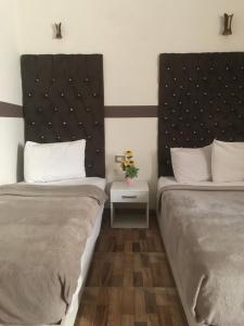 Voodi või voodid majutusasutuse Hotel velvet One toas