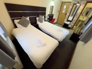 Letto o letti in una camera di Epsilon Hotel