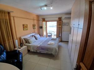 Postel nebo postele na pokoji v ubytování Villa Alexandros