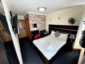 Letto o letti in una camera di Epsilon Hotel