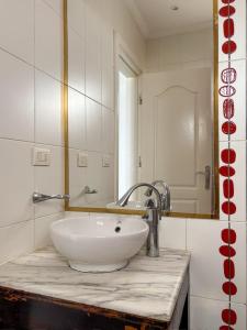 a bathroom with a white sink and a mirror at DeltaStar in Sharm El Sheikh +4 photos