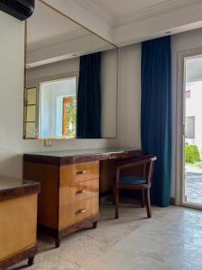 a dressing room with a vanity and a mirror at DeltaStar in Sharm El Sheikh