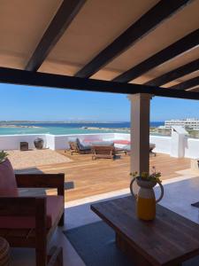 a living room with a view of the ocean at Formentera Especial in La Savina