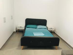 En eller flere senge i et værelse på Garsoniera Tudor