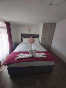 Ein Bett oder Betten in einem Zimmer der Unterkunft Panda Rooms