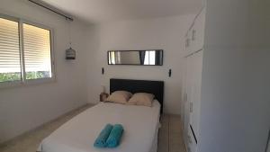 Ένα ή περισσότερα κρεβάτια σε δωμάτιο στο Villa Cap Jaune, Piscine, Détente, Vue à Vincendo