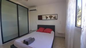 Ένα ή περισσότερα κρεβάτια σε δωμάτιο στο Villa Cap Jaune, Piscine, Détente, Vue à Vincendo