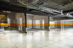 an empty room with orange stripes on the walls at Boutique Hotel ERB - Adults Only in Banská Štiavnica