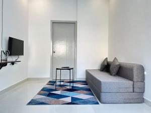 a living room with a couch and a table at 1Bhk in Hennur 1st floor near Bhartiya city 101 in Bengaluru