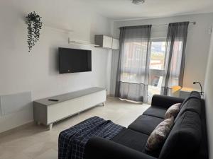 TV a/nebo společenská místnost v ubytování Edificio Raso de la Bruma