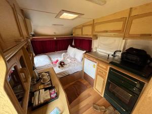 an interior view of an rv with a bed in it at Chiangkhan River Green Hill in Ban Noi
