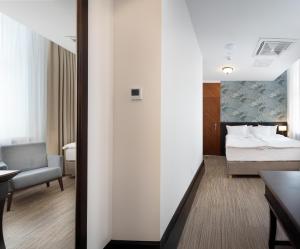 Postel nebo postele na pokoji v ubytování Brovaria Boutique Hotel Stary Rynek - Old Town Square