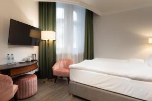 Postel nebo postele na pokoji v ubytování Brovaria Boutique Hotel Stary Rynek - Old Town Square