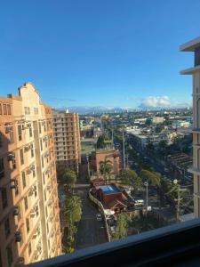 a view of a city from a building at Cozy studio unit 10mins from Airport 20mins from US Embassy across SM Sucat in Manila