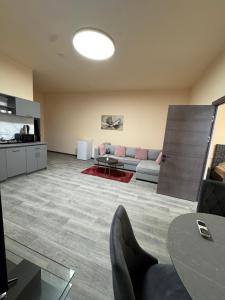 a living room with a couch and a table at Family Guest House in Yerevan